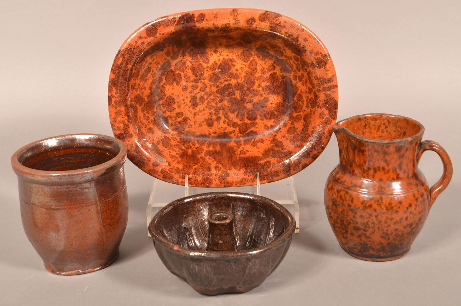Lot of 19th Century Glazed Redware.: Lot of 19th Century Glazed Redware. Including a Turks mold, pitcher, loaf pan and a crock. Pitcher measures 6-1/2"h. Condition: Fair with wear, chips and cracks.