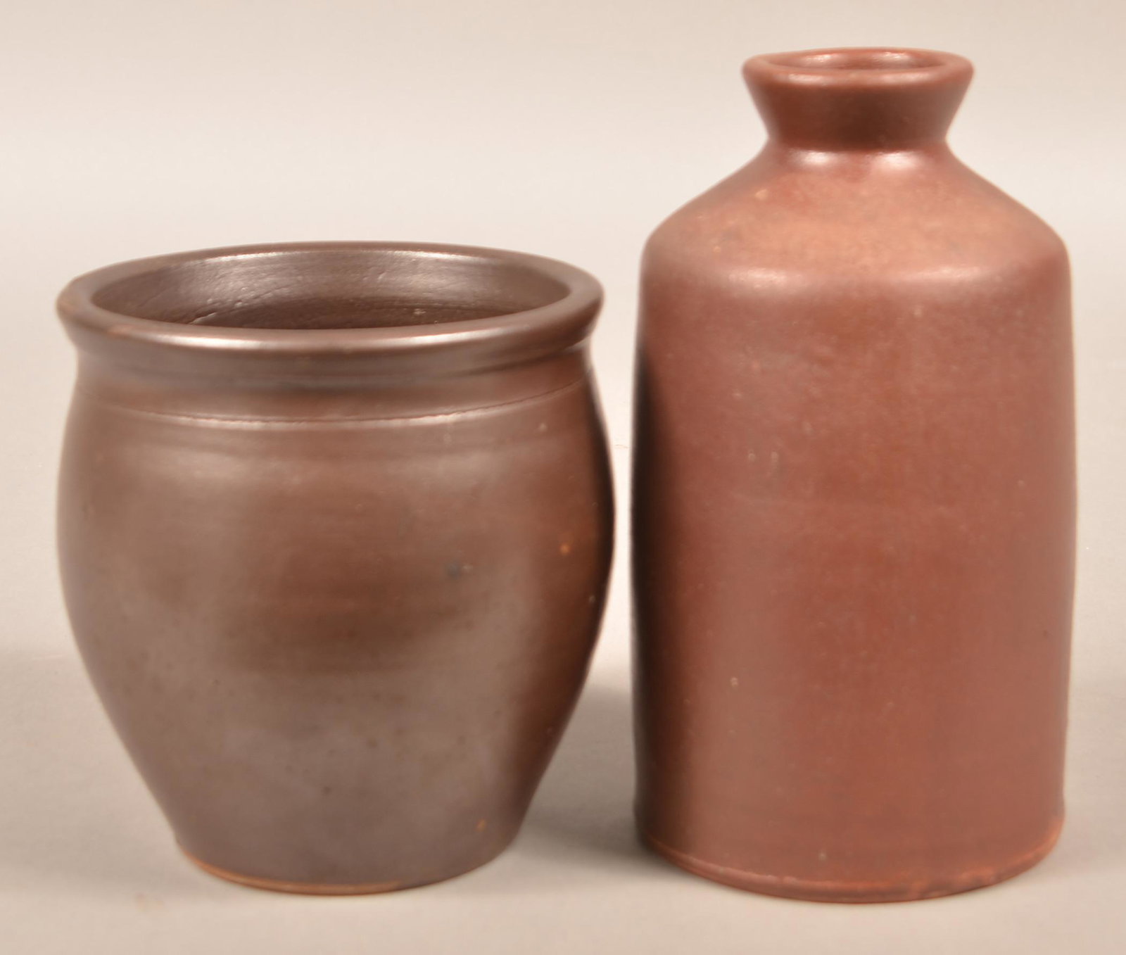 Two H.H. Zigler, Newville, PA Earthenware Storage Jars.: Two H.H. Zigler, Newville, PA Earthenware Storage Jars. Circa 1852-1865. Both stamped on base. Largest measures 8-1/2"h. Condition: Very good.