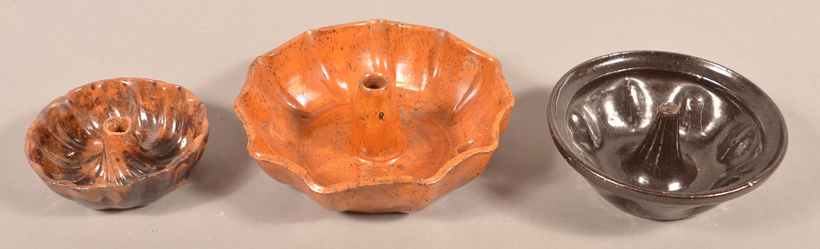 Three Antique Glazed Redware Turks Molds.: Three Antique Glazed Redware Turks Molds. Largest 7-3/4"h. Condition: Good with chips and lines.