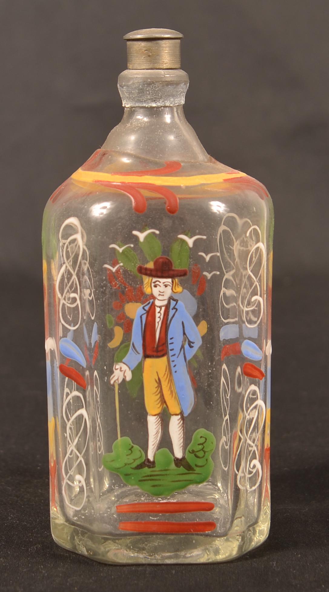 Stiegel Type Enamel Decorated Glass Cologne Bottle.: Stiegel Type Polychrome Enamel Decorated Colorless Glass Cologne Bottle. Gent with walking stick, floral and foliate decoration. 5-1/2"h. Condition: Very good with minor loss.