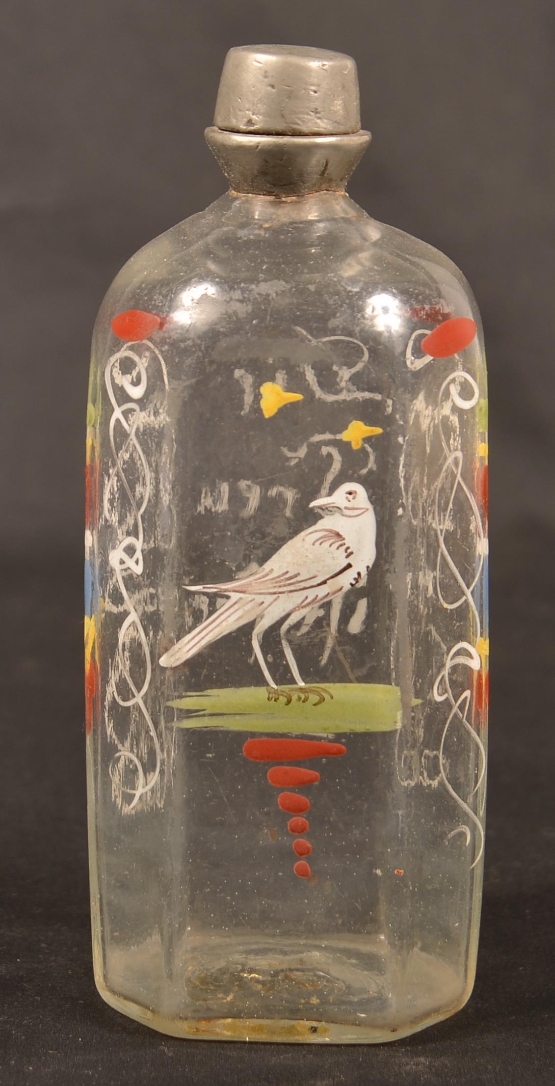 Stiegel Type Enamel Decorated Glass Cologne Bottle.: Stiegel Type Polychrome Enamel Decorated Colorless Glass Cologne Bottle. Bird, floral and foliate decoration. 6"h. Condition: Good with minor loss, missing cap.
