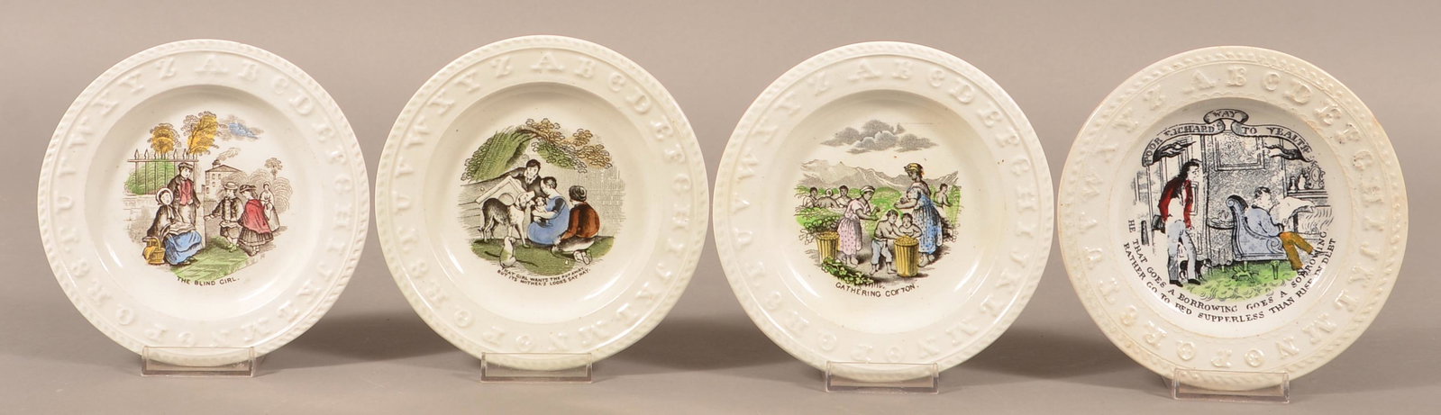 4 Decorated Ironstone China Child's Alphabet Plates.: Four Transfer Decorated Ironstone China Child's Alphabet Plates. Largest 6-1/8" diam. Condition: Good with minor wear, one with chip on back.