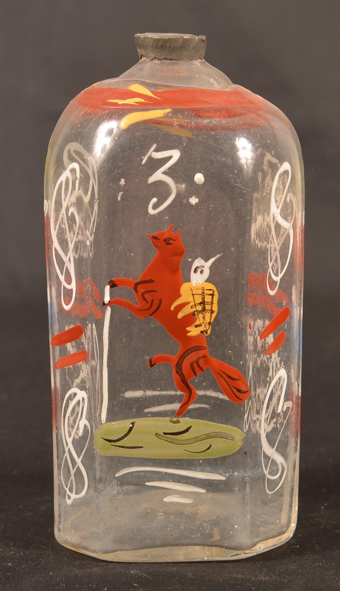 Stiegel Type Enamel Decorated Glass Cologne Bottle.: Stiegel Type Polychrome Enamel Decorated Colorless Glass Cologne Bottle. Figure on horse, floral and foliate decoration. 5-1/4"h. Condition: Good with minor wear.