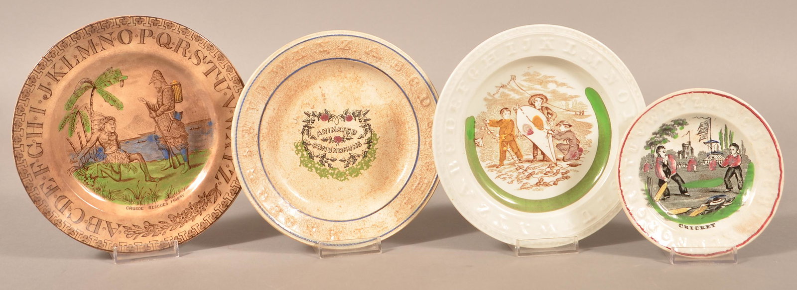 4 Decorated Ironstone China Child's Alphabet Plates.: Four Transfer Decorated Ironstone China Child's Alphabet Plates. Largest 7-1/2" diam. Condition: Good with minor wear and stains.