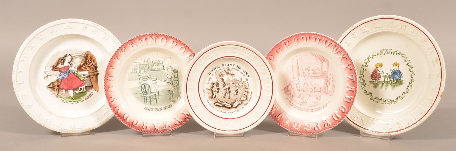 5 Decorated Ironstone China Child's Alphabet Plates.: Five Transfer Decorated Ironstone China Child's Alphabet Plates. Largest 8-1/8" diam. Condition: Good with minor wear and stains.