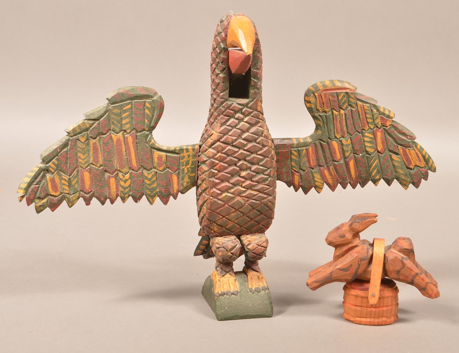 Two Contemporary Folk Art Schimmel Type Carvings.: Two Contemporary Folk Art Schimmel Type Carvings. Jonathon Bastian 1990 Rabbit with basket, 3-3/4"h. and Museum of American Folk Art collection Eagle nutcracker, signed "M.M.S. 99", 10-3/4"h. Conditio