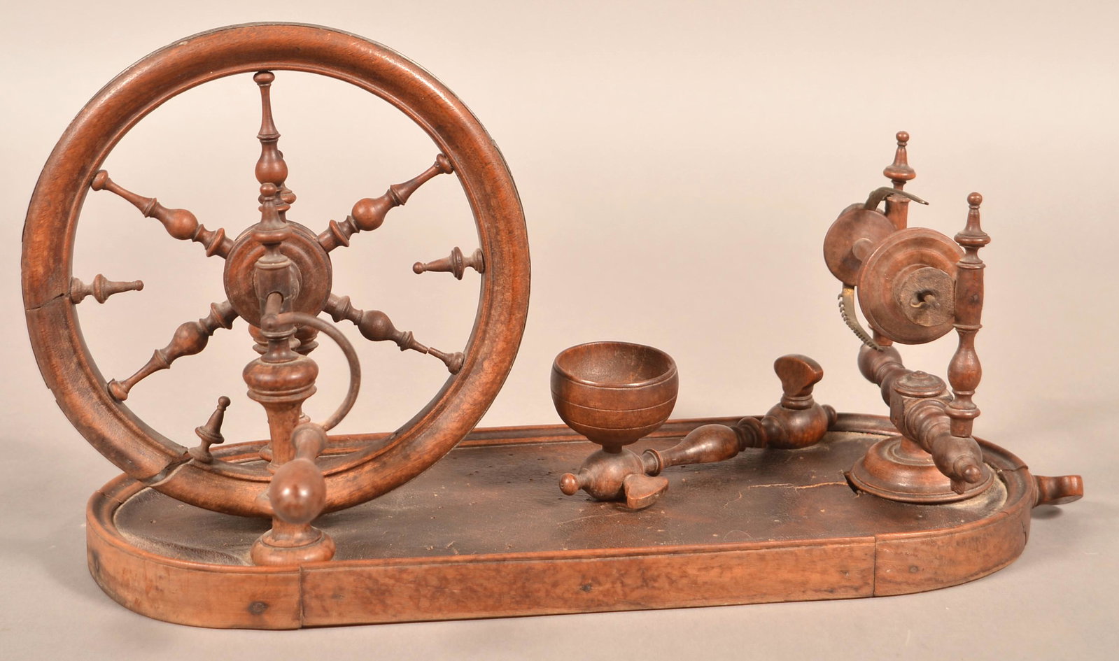 American Early 19th Century Table-top Spinning Wheel.: American Early 19th Century Table-top Spinning Wheel. 16-1/2"l. Condition: Good with wear and losses.