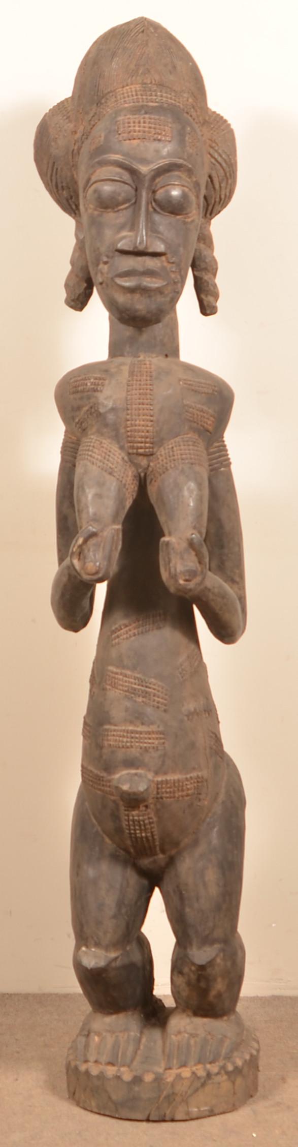 Antique/Vintage African Wood Tribal Fertility Figure.: Antique/Vintage African Carved Wood Tribal Female Fertility Figure. 55-1/2"h. Condition: Good with wear and age cracks.