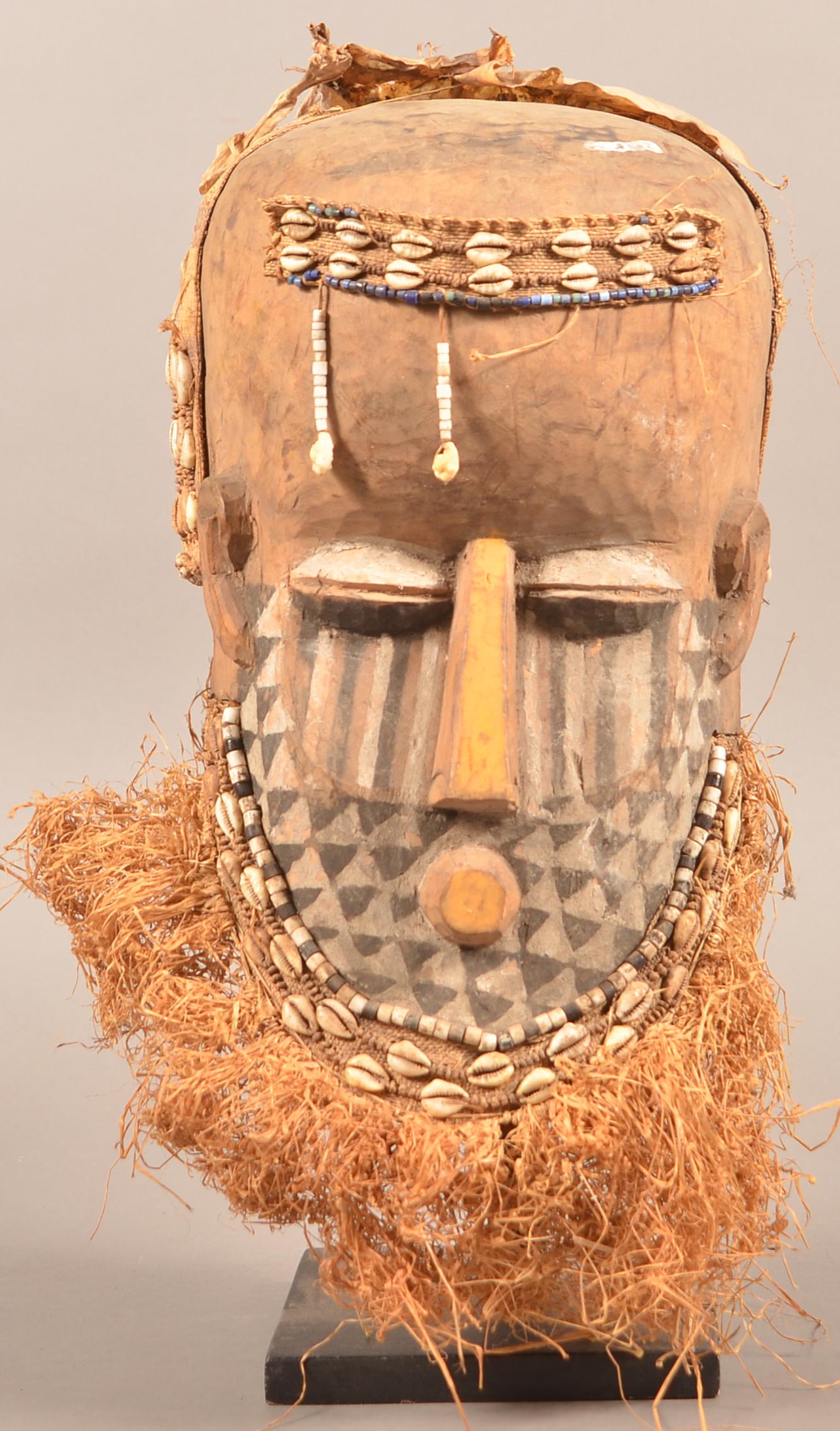 Antique/Vintage African Wood Tribal Mask.: Antique/Vintage African Carved Wood Tribal Mask. Shell and bead decoration. Tallest measures 16"h. Condition: Good with wear and age cracks.