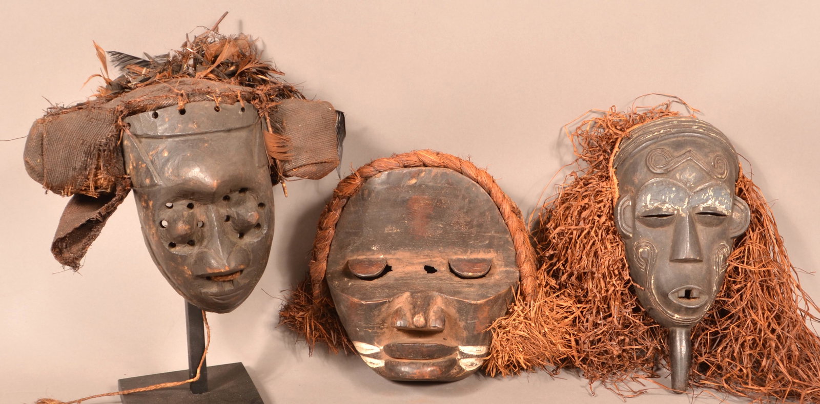 Three Antique/Vintage African Wood Tribal Masks.: Three Antique/Vintage African Carved Wood Tribal Masks. Tallest measures 15"h. Condition: Good with wear, cracks and losses.