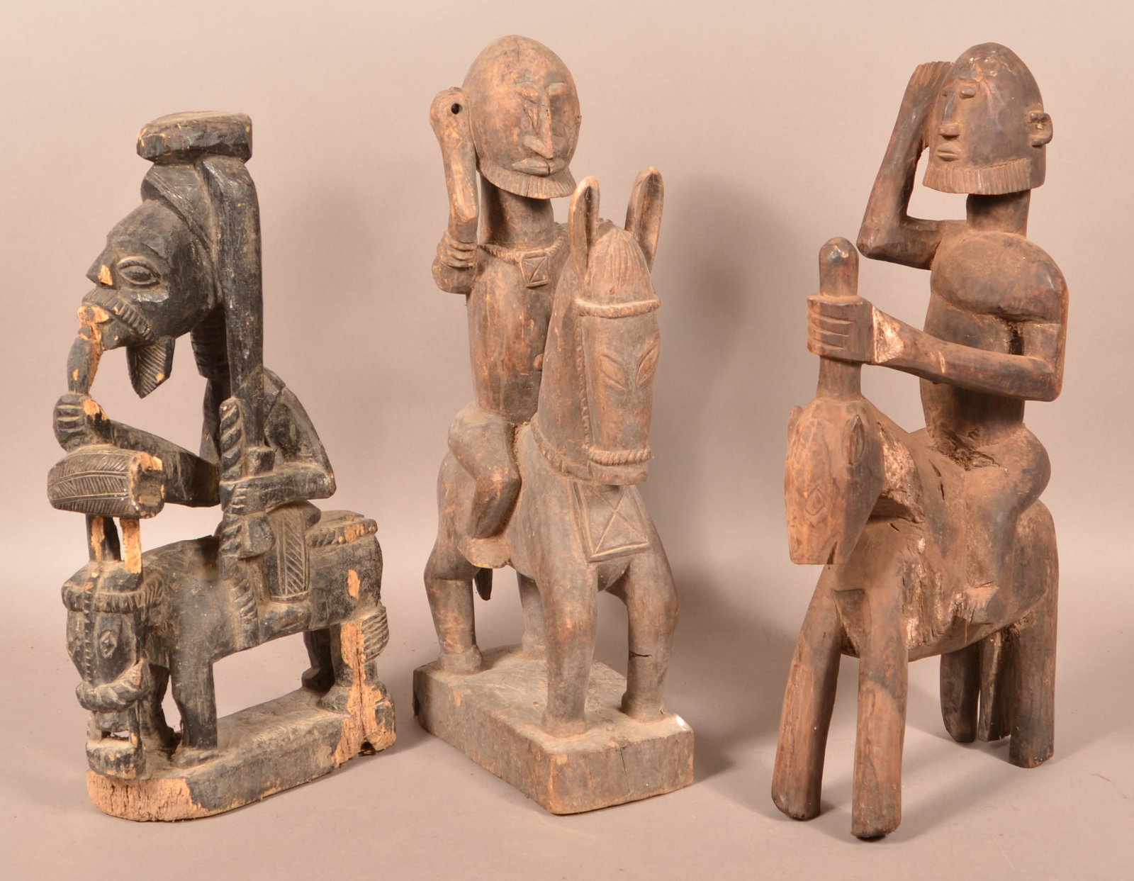 3 Antique/Vintage African Tribal Figures on Horseback.: Three Antique/Vintage African Carved Wood Tribal Figures on Horseback. Tallest measures 24"h. Condition: Good with wear, cracks and losses.