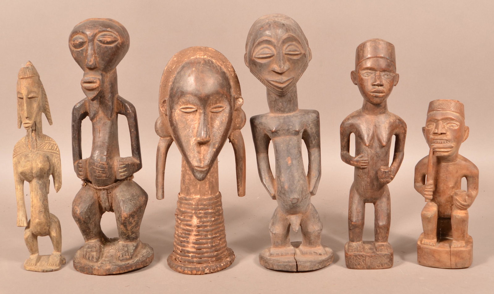 Six Antique/Vintage African Wood Tribal Figures.: Six Antique/Vintage African Carved Wood Tribal Figures. Tallest measures 17-1/2"h. Condition: Good with wear, cracks and losses.