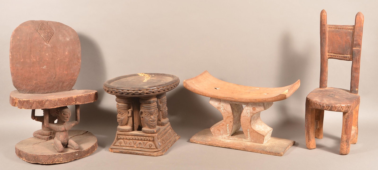 4 Antique/Vintage African Wood Tribal Stools/Chairs.: Four Antique/Vintage African Carved Wood Tribal Stools/Chairs. Tallest measures 24"h. Condition: Good with wear, cracks and losses.