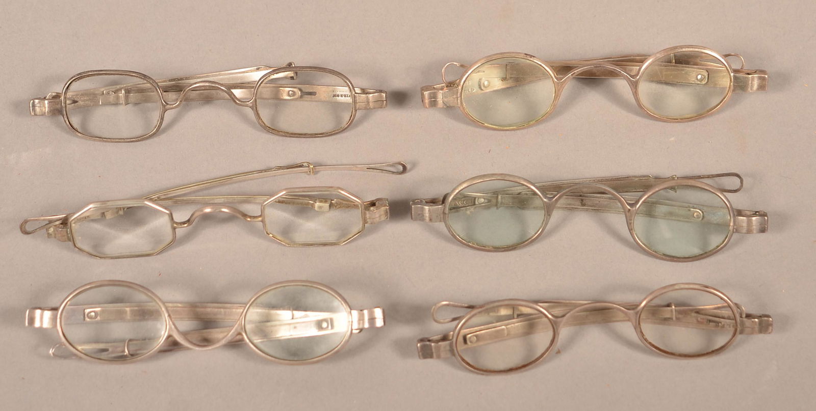Six Pairs of 19th Century Coin Silver Frame Eye: Six Pairs of 19th Century Coin Silver Frame Eye Glasses. Handler Darrow, W.W. Wilson, S. Flacc, McAllister, E. Sargent and A. Wood. Condition: Good with use wear.