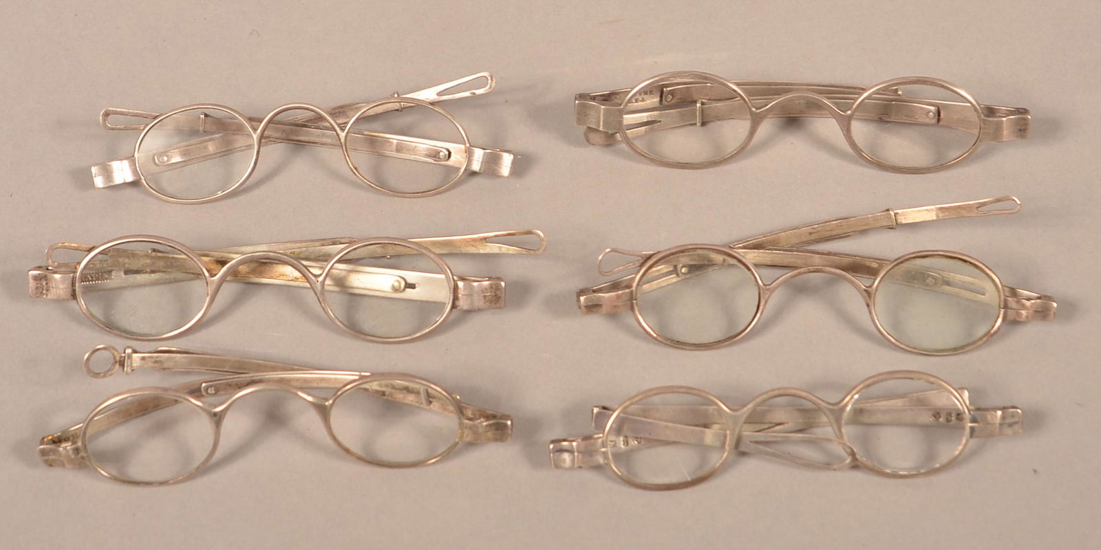 Six Pairs of 19th Century Coin Silver Frame Eye: Six Pairs of 19th Century Coin Silver Frame Eye Glasses. O. Chapin, McAllister, (Philadelphia), A.W. Fisher, P.B., English marked and one unmarked. Condition: Good with use wear.