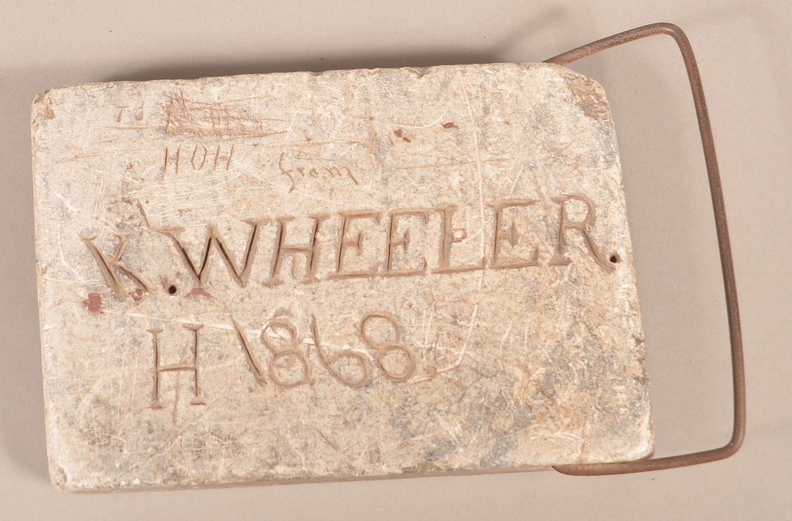 Soapstone Footwarmer Incised "K. Wheeler 1868".: Soapstone Footwarmer Incised "K. Wheeler 1868". 10"w. Condition: Good with wear and loss.