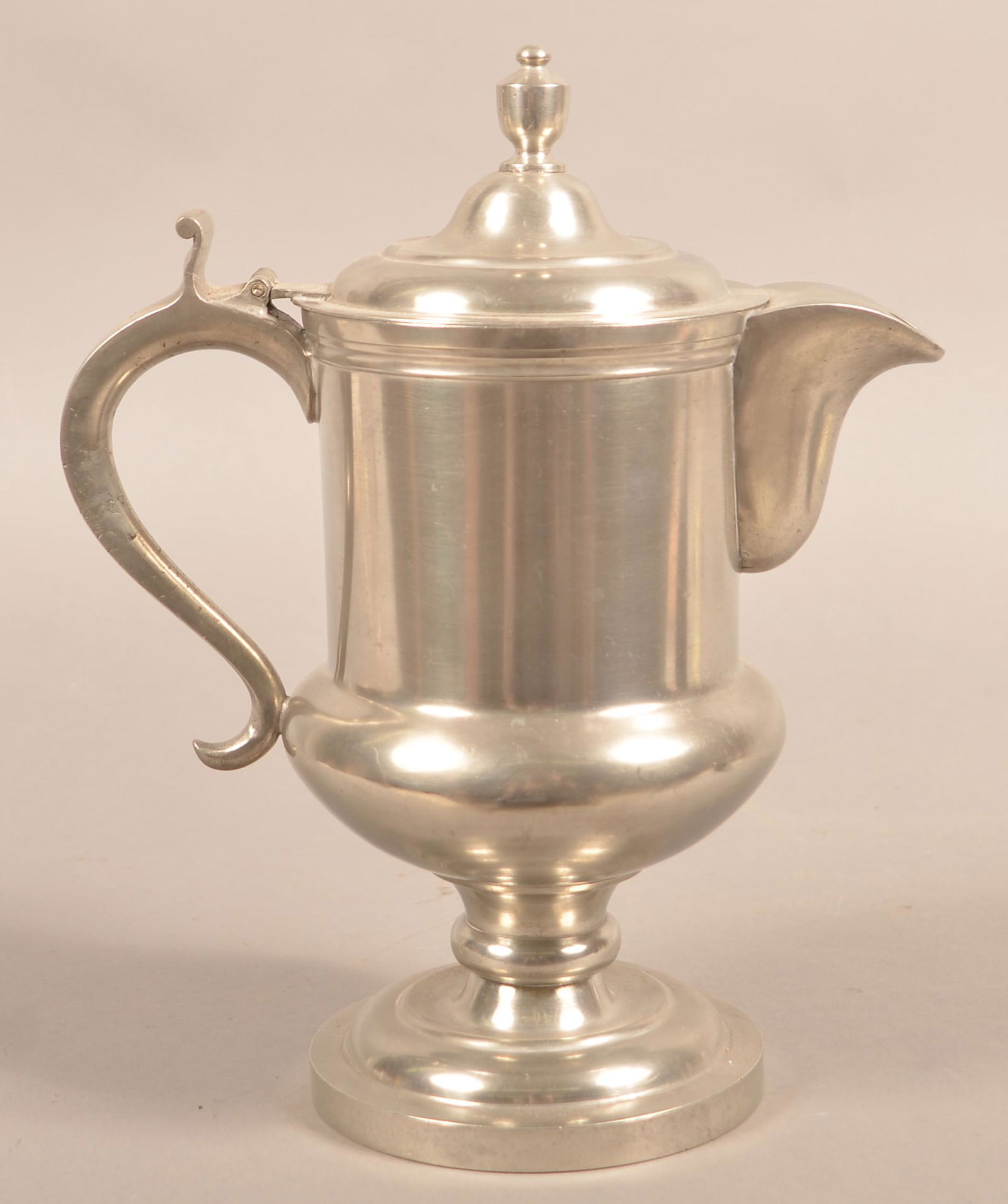 Oliver Trask Pewter Footed Flagon, Circa 1830–40.: Oliver Trask Pewter Footed Flagon, Circa 1830–40. (Beverly, Mass., 1792–1847). 12-3/4"h. Condition: Very good with minor wear.