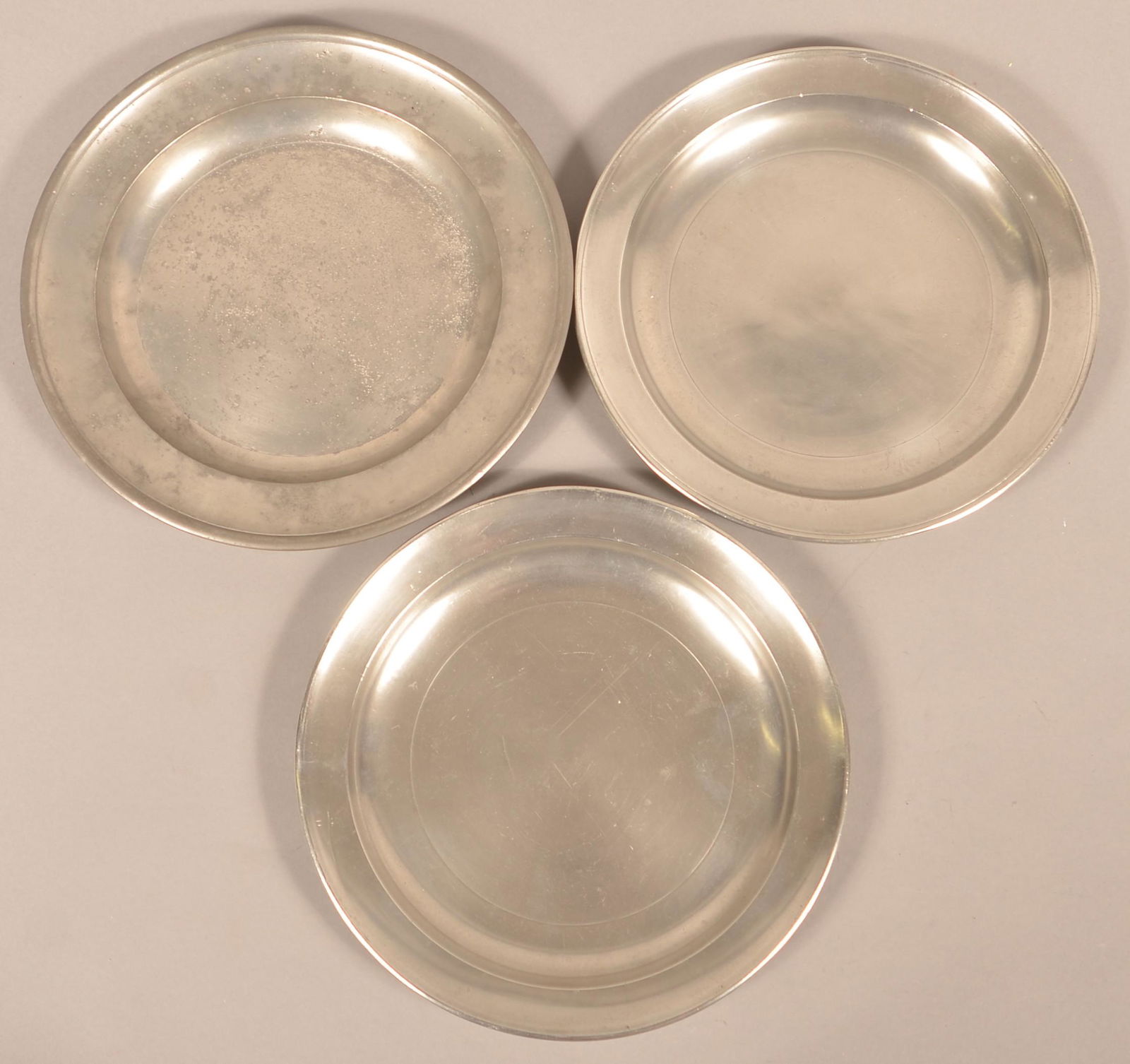 Three Various Pewter Communion Plates.: Three Various Pewter Communion Plates. One signed "Calder". (William Calder, Providence, R.I., 1817-1856). 11-1/2" diam.