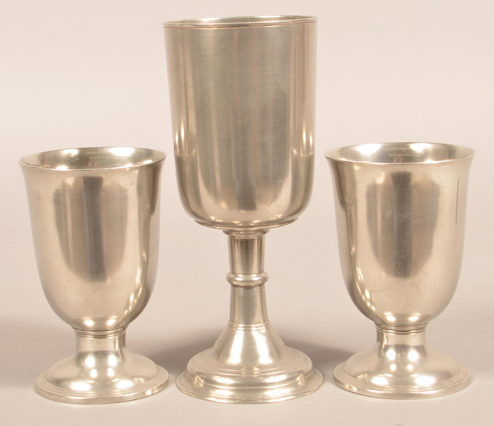 Three Unsigned American Pewter Chalices.: Three Unsigned 19th Century American Pewter Chalices. Largest measures 8-1/2"h. Condition: Very good with minor wear.