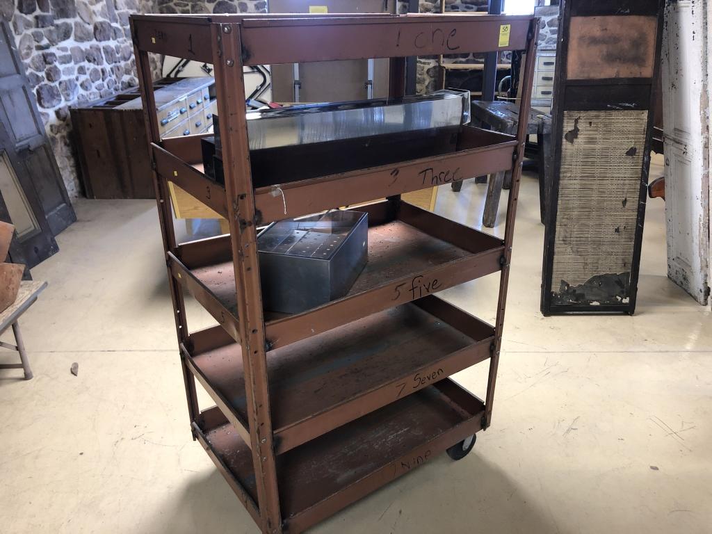 Industrial Rolling Shelf Cart: with 5 trays. 60"H x 36"L x 24"W. Condition: Good with minor bent metal.