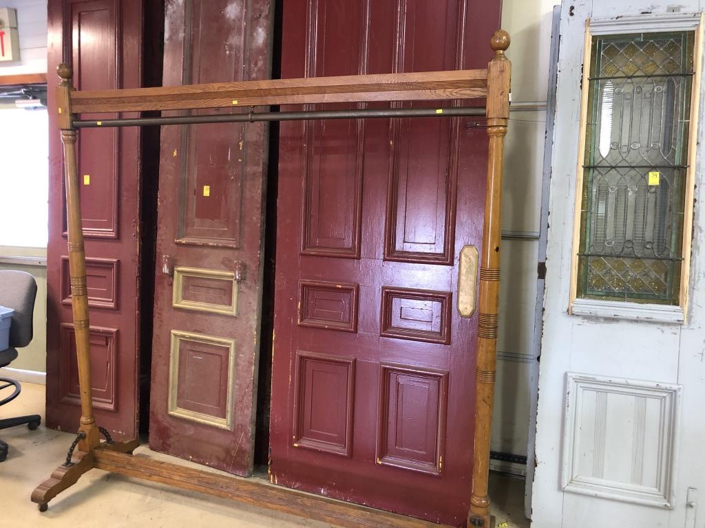 Victorian Rolling Coat Rack: with brass bar and turned & reeded columns. 79"H x 78"W. Condition: Good.