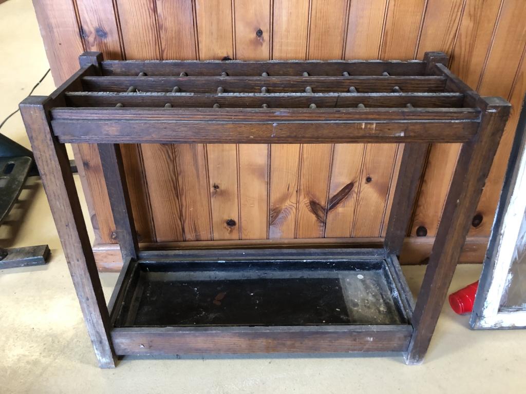 Early Oak Umbrella Stand: with galvanized letters & metal tray. 32 1/2"W x 27 1/2"H x 12 3/4"D. Condition: Good with minor use & wear.
