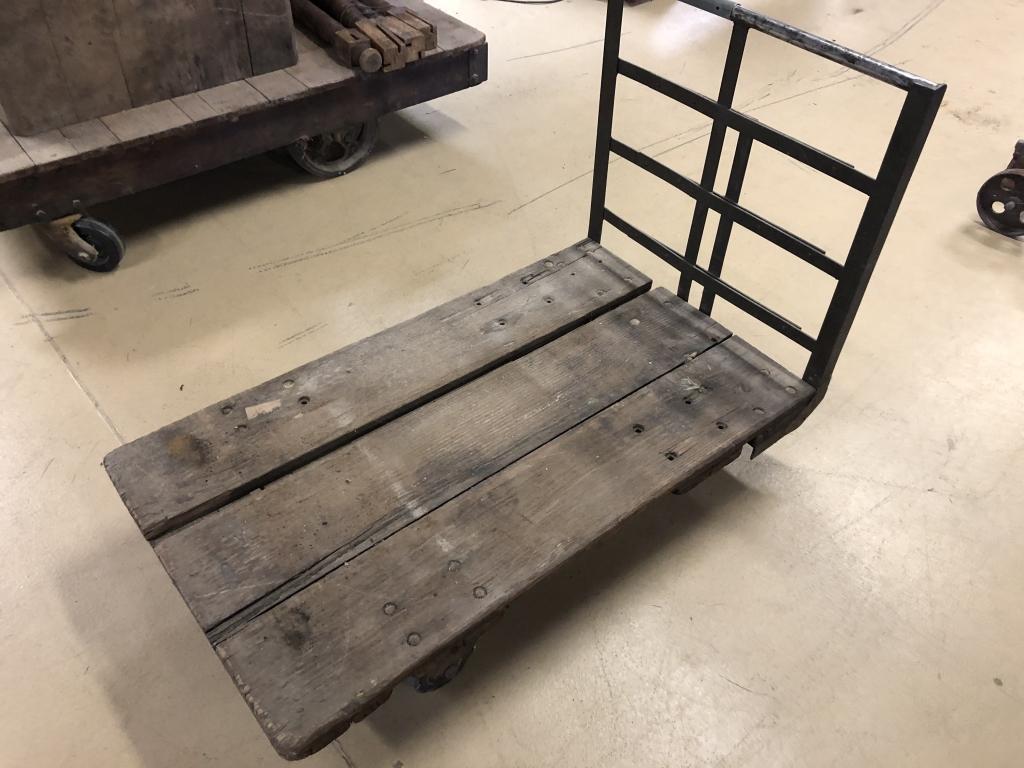 Vintage Industrial 4 Wheel Rolling Cart: Oak Base and metal handle. 48" L x 26 1/2"W. Condition: Good with use and wear.