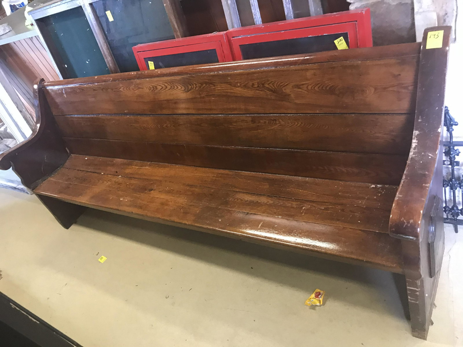 Early Church Pew With Scrolled Arm: Late 19th Century. 58"L. Condition: Partial bench, missing arm.