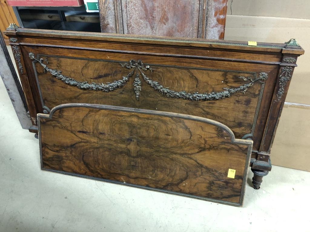 Decorative Burlwood Footboard: with applied brass ornate decorations. Includes partial headboard w/ applied brass decorations. 60"W x 35"H. Condition: Good.
