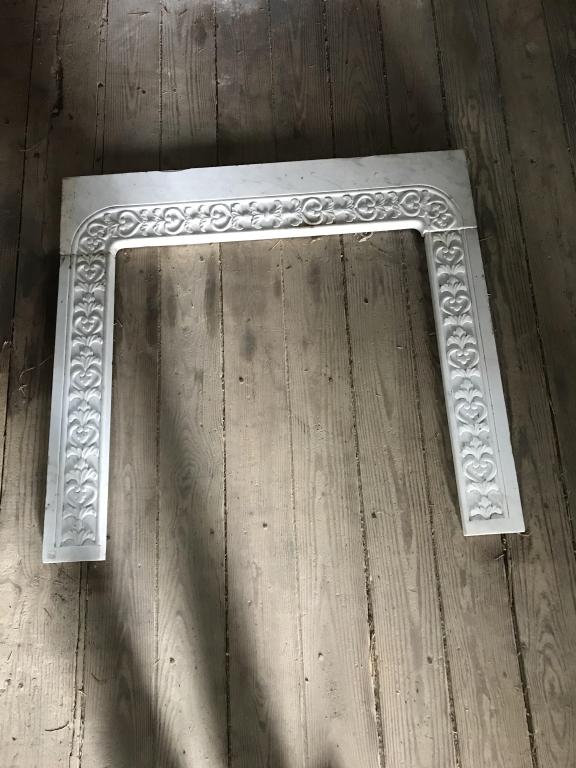 White Marble 3 Piece Fire Place Mantle: with ornate relief carving. W-45-3/4 H-42”. Condition: Good with minor chip on left side.