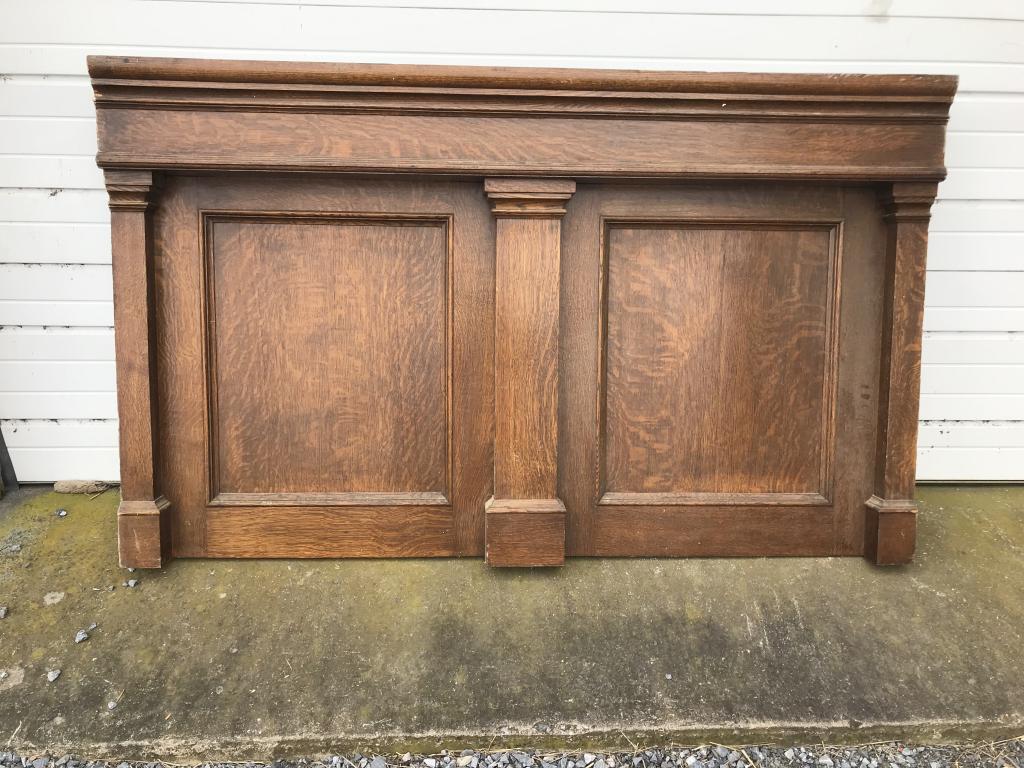 Quarter Sawn Oak Panel : with square columns, bold cornice and paneled front. L-75-1/8”H-45-1/8. Condition: Very good, top had spindles on top.