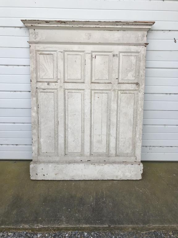 Oak Quarter Sawn Raised Panel: with cornice molding and religious shield. W-43-1/2”H-60-1/4”. Condition: Painted white over stain finish.