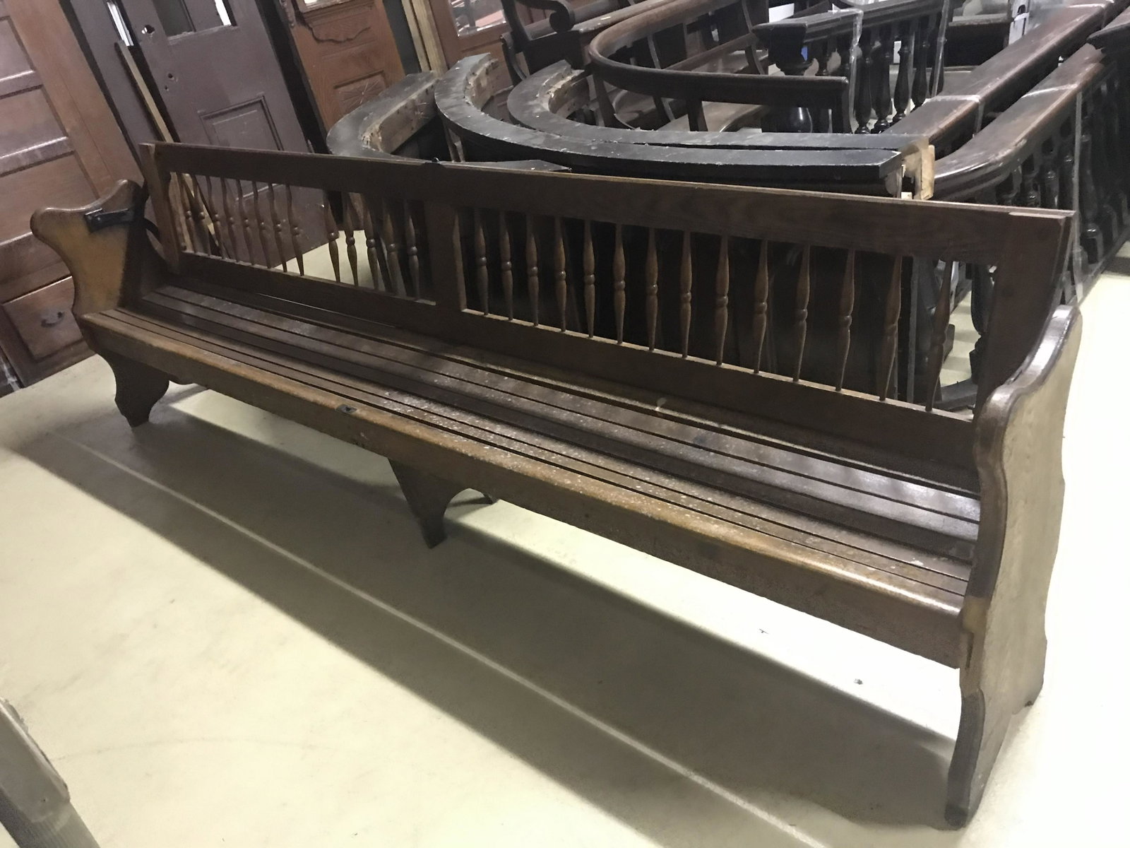 Early Railroad Bench: With slatted seat and spindle back. L-108”. Condition: Good.