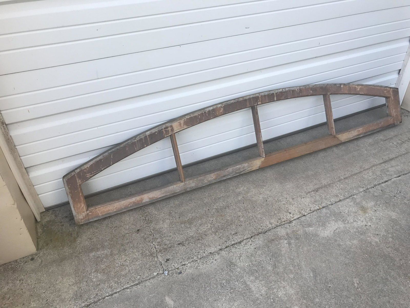 Early 4 Pane Arched Window Transom: From Lititz train station. L-73-3/4”H-14-3/4”. Condition: Good with professional repairs.