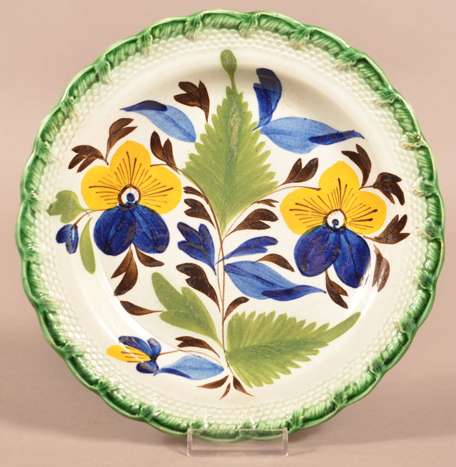 Leeds Soft Paste China Pansy Pattern Plate.: Leeds Green Feather Edge Soft Paste China Pansy Pattern Plate. Embossed fern leaf and scale border. 8-3/4" diam. Condition: Very good.