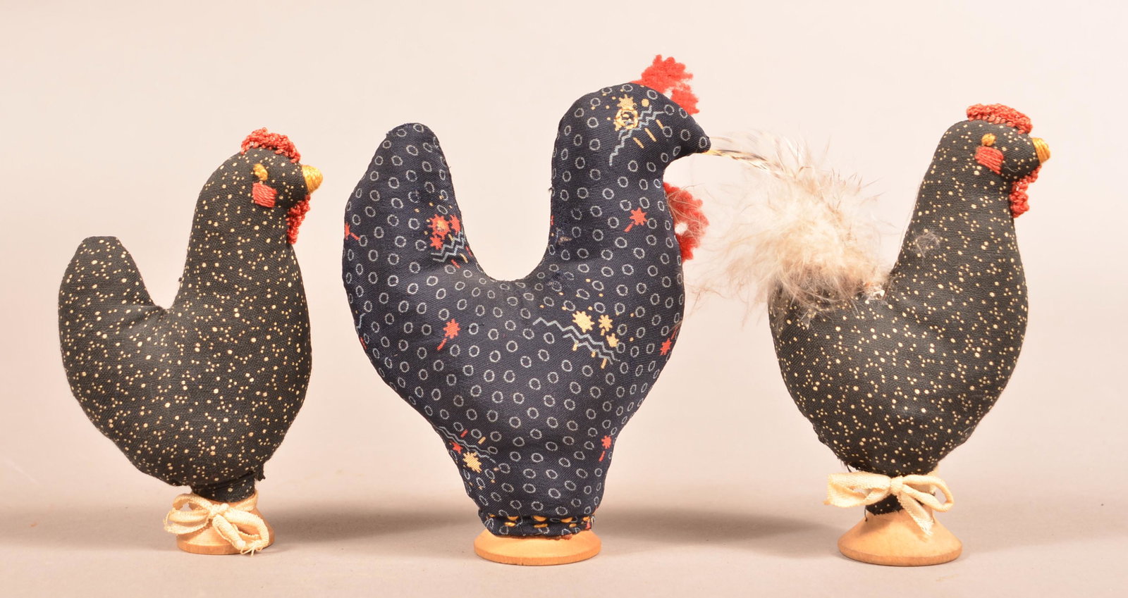 Three Amish Rooster-Form Fabric Pin Cushions.: Three Antique/Vintage Amish Rooster-Form Fabric Pin Cushions. Each hand-stitched with wooden spools as weighted bases and applied comb. Eugene and the late Vera Charles, Lancaster, PA. 4-1/2" to 5-1/4