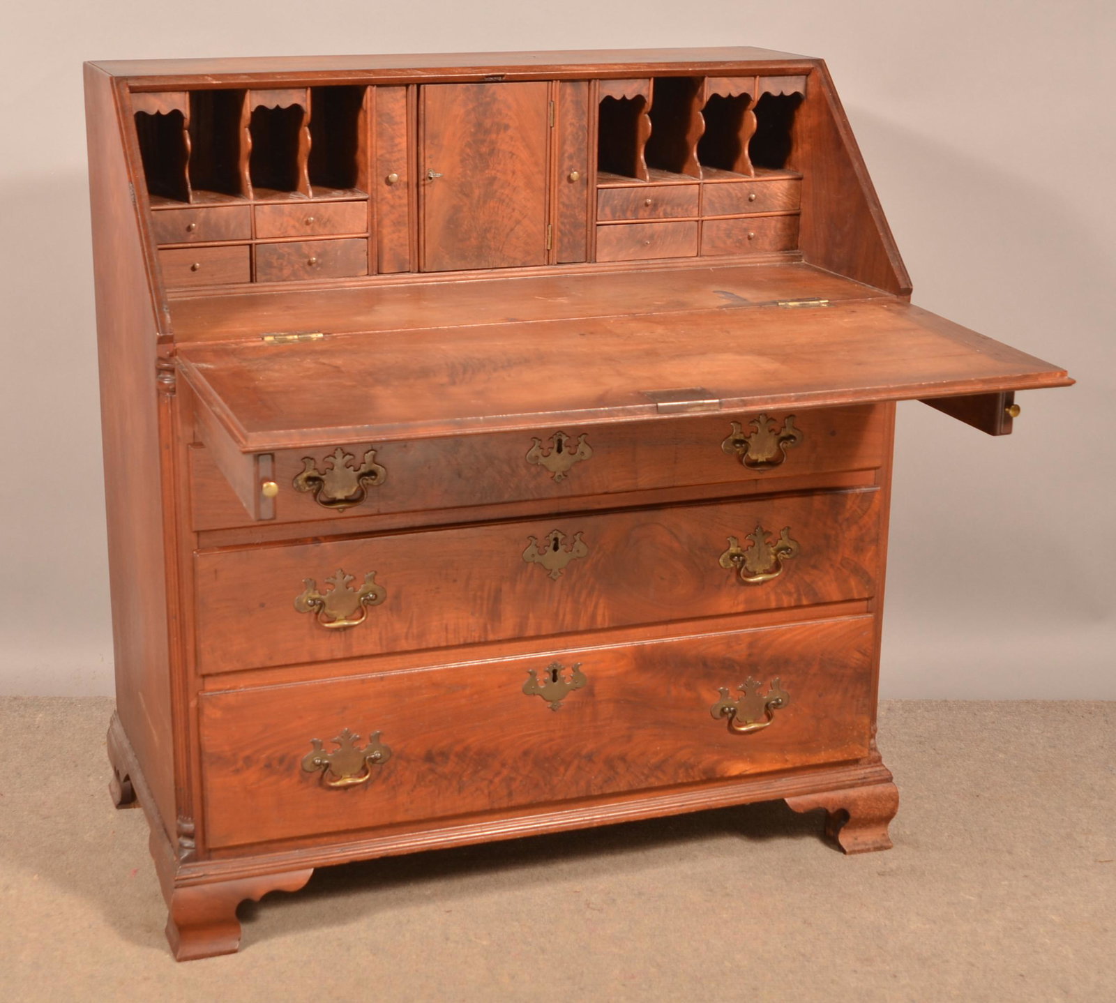 Pennsylvania Chippendale Walnut Slant-Lid Desk.: Pennsylvania Chippendale Walnut Slant-Lid Desk. Circa. 1770-1790. Dovetailed case, slant lid with pull-out supports, interior with central prospect door flanked by book-end drawers and pigeon hole com