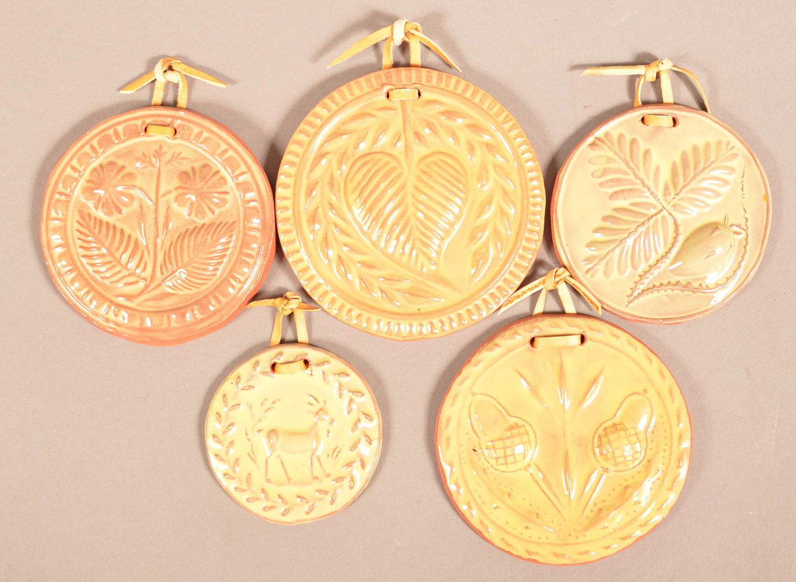 Five Redware Butter Print Impression Ornaments.: Five Redware Butter Print Impression Ornaments. All are signed "SAE". 2-3/4" to 4-1/8" diam. Condition: Very good, one broken and glued.