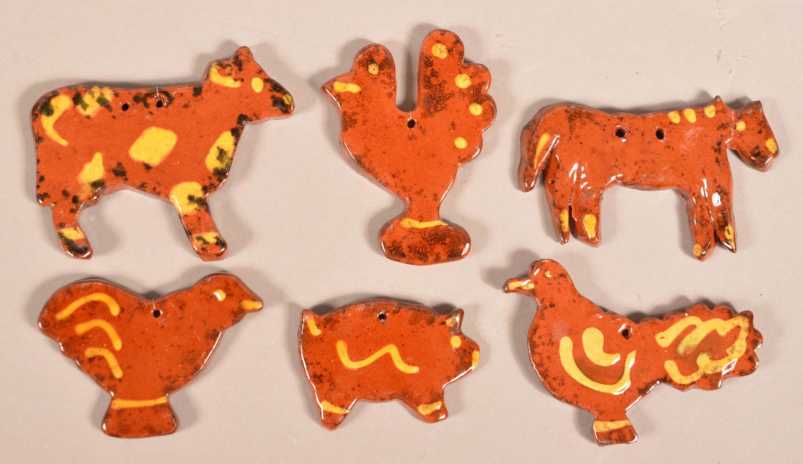 Six Slip Decorated Redware Animal Ornaments.: Six Slip Decorated Redware Animal Ornaments. Unsigned, attributed to Foltz Pottery. Tallest 3-1/2"h. Condition: Very good, one broken and glued.