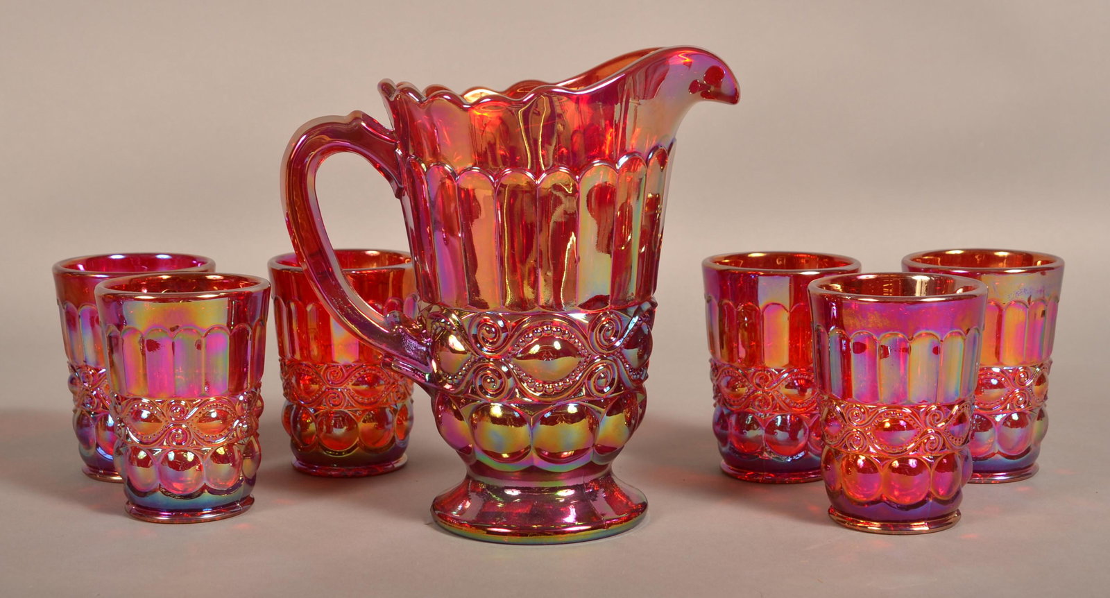 Mosser Red Carnival Glass Eyewinker 7 Piece Water Set.: Mosser Red Carnival Glass "Eyewinker" Seven Piece Water Set. Pitcher 8"h. and six tumblers, 4"h. Condition: Very good.