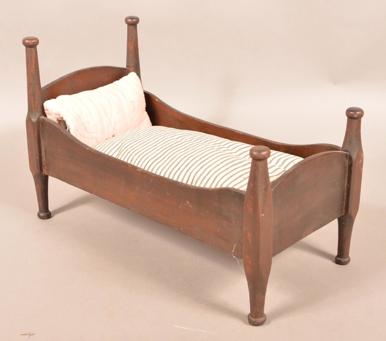 Antique Softwood Primitive Doll Bed.: Antique Softwood Primitive Doll Bed. 14"h. x 11"w. x 21-1/2"l. Condition: Good with wear.