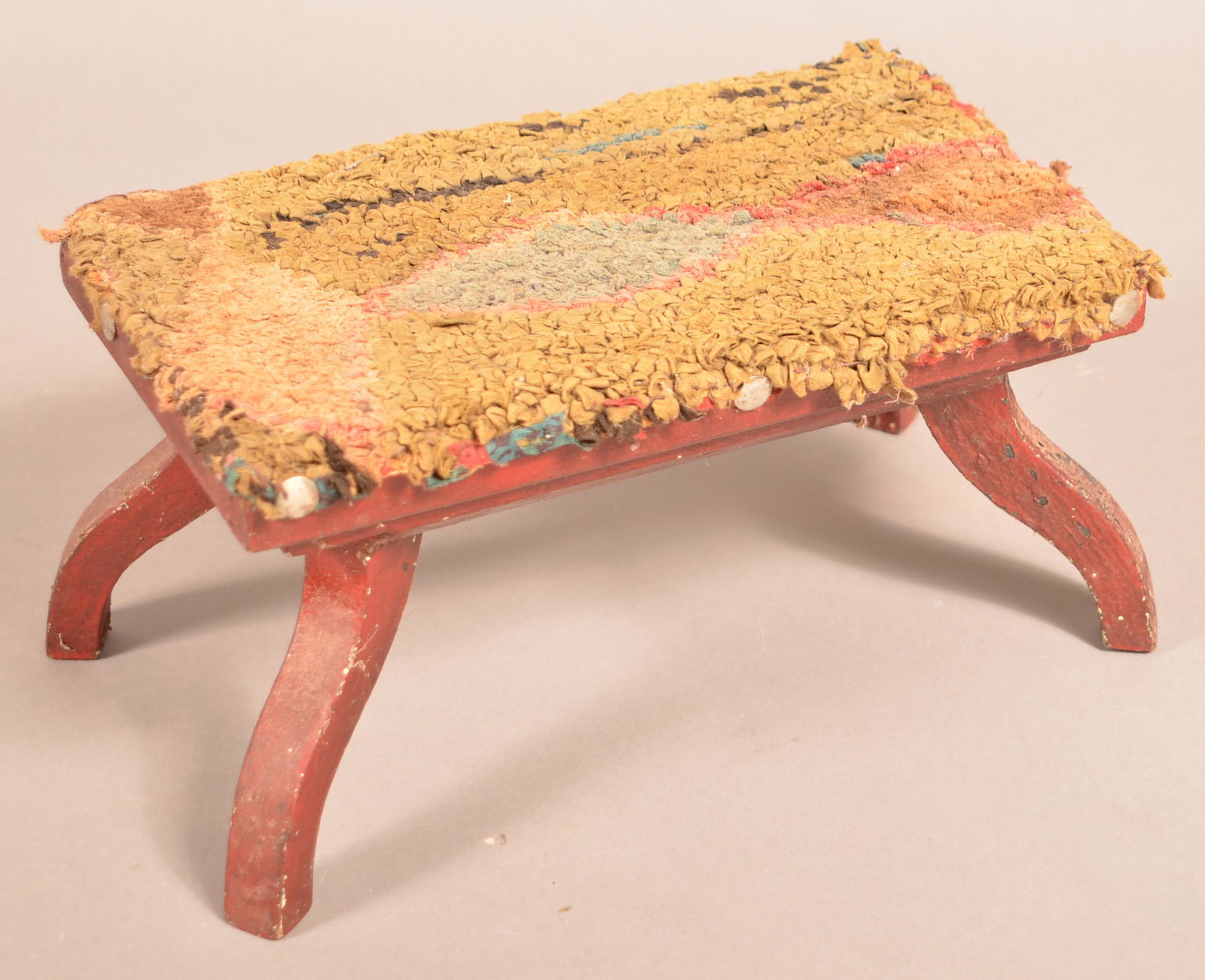 Antique Red Painted Softwood Footstool.: Antique Red-Painted Softwood Footstool. With hooked rug type top. 6-1/4"h. x 12"w. x 7"d. Condition: Good with wear.