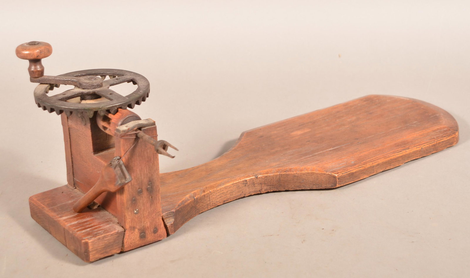 19th Century Wooden Apple Peeler.: 19th Century Wooden Apple Peeler. Crank action with plank base. 24-1/2"l. overall. Condition: Good with use wear.