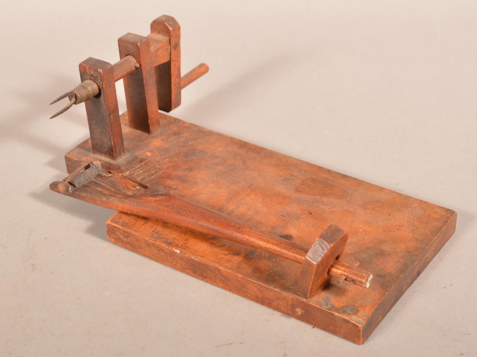 19th Century Wooden Apple Peeler.: 19th Century Wooden Apple Peeler. Crank action with plank base. 13-1/2"l. overall. Condition: Good with use wear.