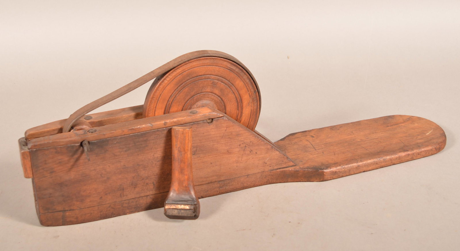19th Century Wooden Apple Peeler.: 19th Century Wooden Apple Peeler. Crank action with plank base. 26"l. overall. Condition: Good with use wear.