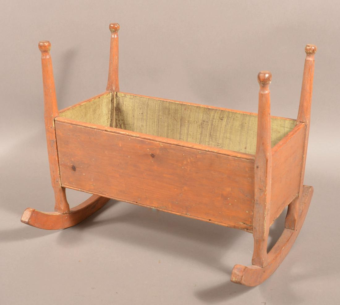 19th Century Painted Pine Doll Cradle.: 19th Century Painted Pine Doll Cradle. Turned posts with beaded boards. 14-1/2"h. x 17"w. x 18-1/2"l. Condition: Good with minor wear and age crack.