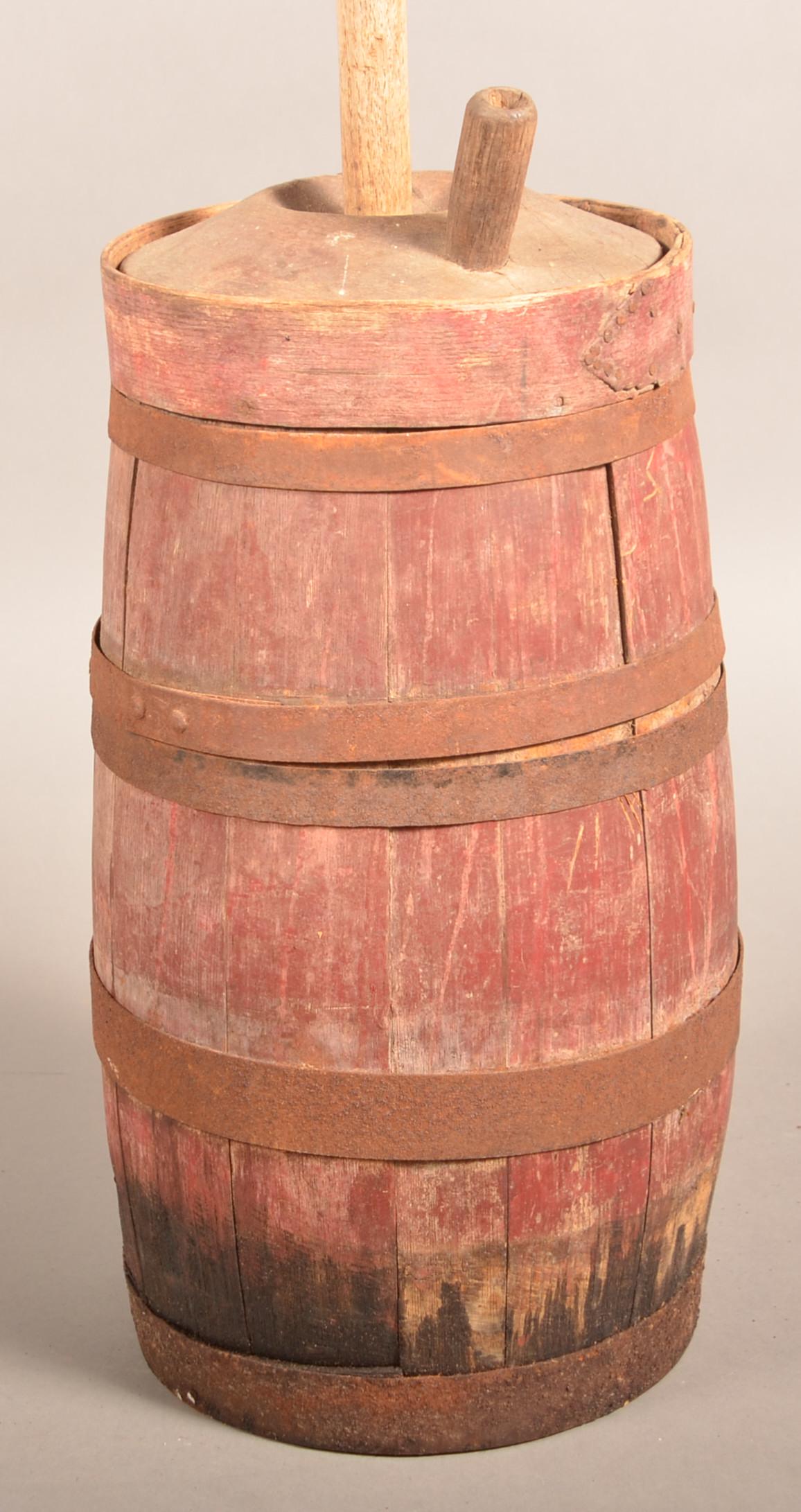 19th Century Oak Stave Butter Churn.: 19th Century Oak Stave Butter Churn. Iron strap support bands, original lid and dasher with old red paint. 43-1/4"h. overall. Condition: Fair with wear. Metal bands have rust and pitting.