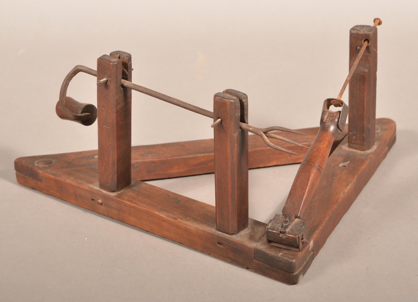 19th Century Wooden Apple Peeler.: 19th Century Wooden Apple Peeler. Crank action with triangular slat base. 18"l. overall. Condition: Good with use wear.