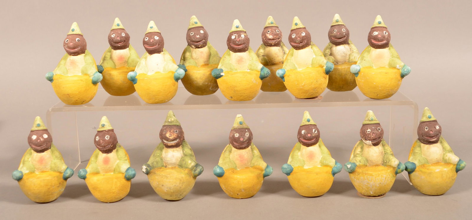 16 German "Lemon Man" Halloween Candy Containers.: 16 German Paper Mache "Lemon Man" Halloween Candy Containers. 3-3/4"h. Condition: Good with wear, most are missing trap bases.