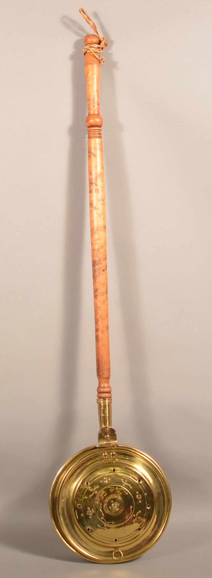 19th Century Brass Bed Warmer/Chestnut Roaster.: American 19th Century Brass Bed Warmer/Chestnut Roaster. Punched floral and foliate engraved hinged lid pan with turned maple handle. 46" long overall. Condition: Good with dents and wear.